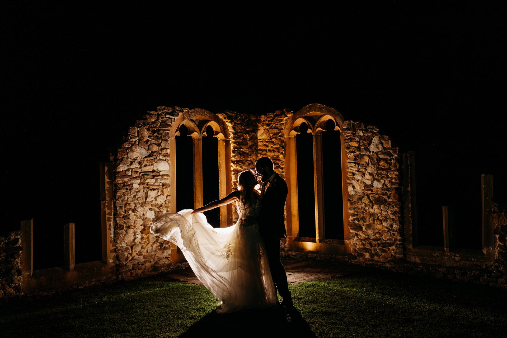 night shot of rustic ruins wedding ceremony location